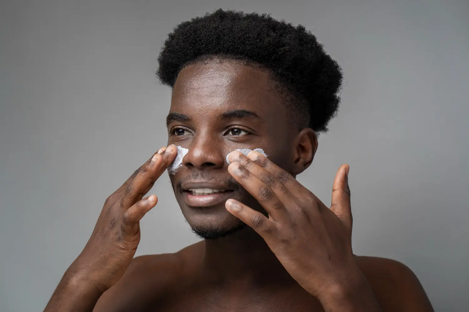 Person with darker skin tone showing that skin cancer can affect all skin types