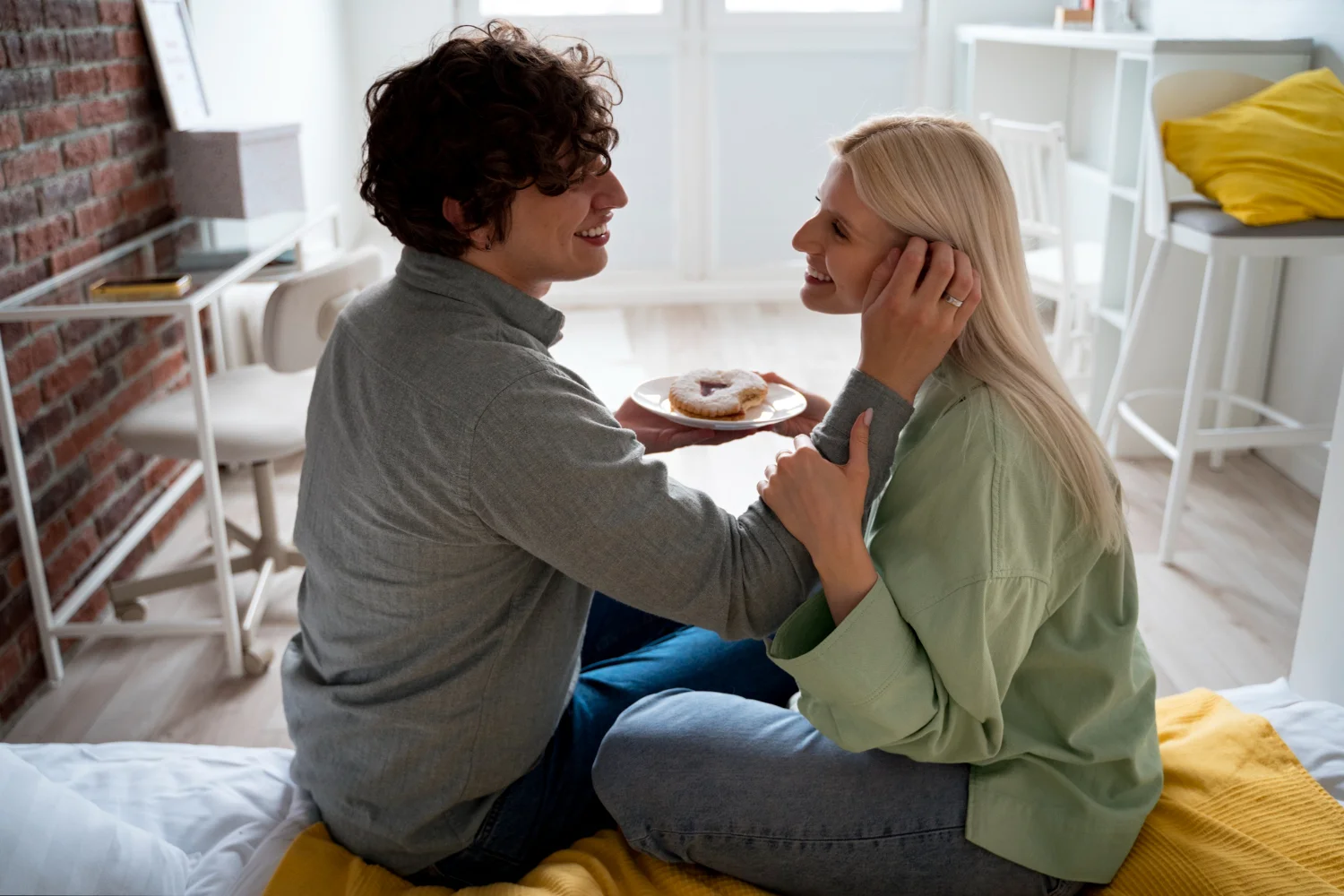 Couple showing emotional connection but physical distance, representing common relationship challenges